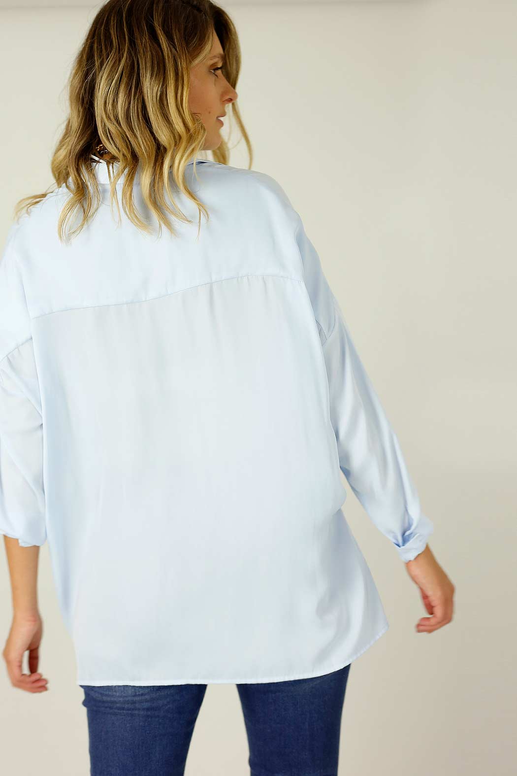 Effortless pale‑blue Seta Everyday Shirt, front view, sleek silhouette, soft drape and subtle cuff—versatile luxe day‑night.