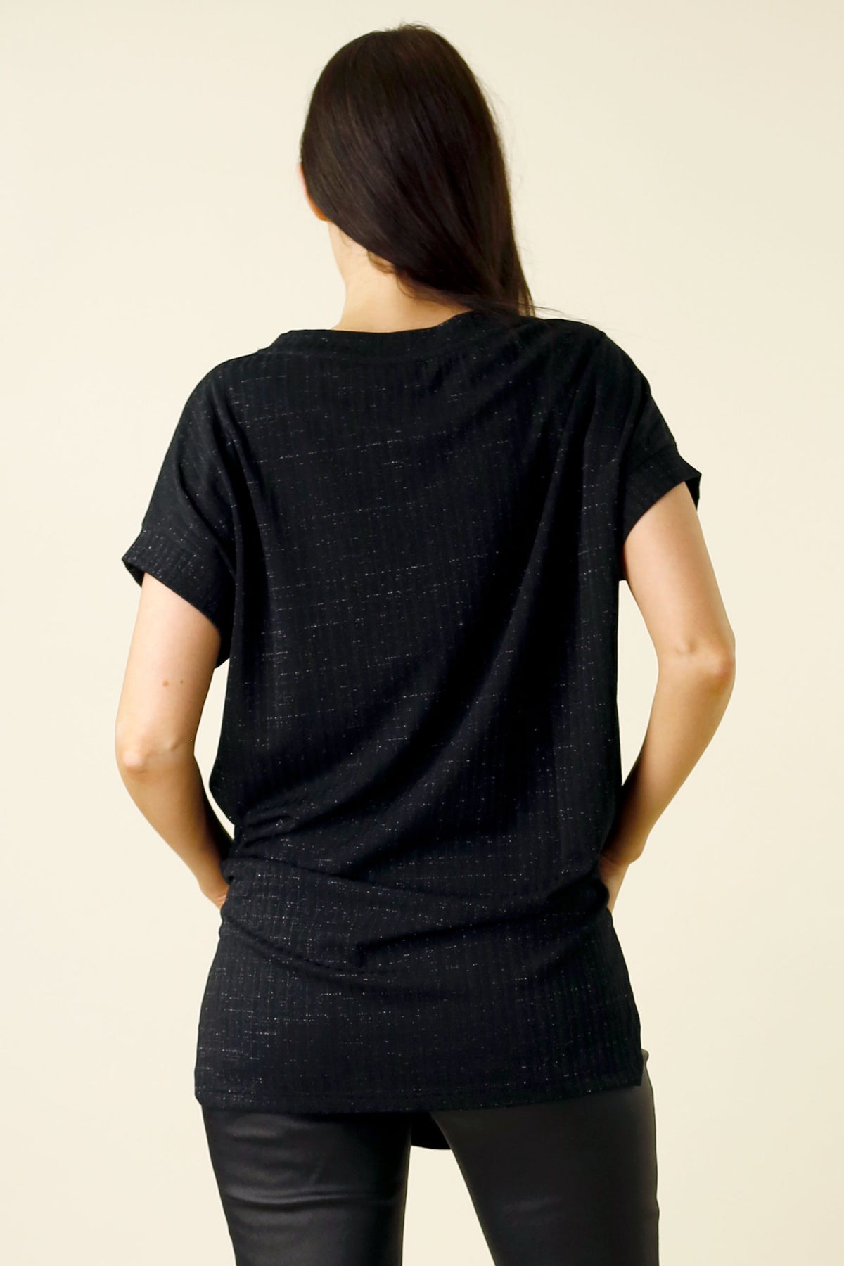 Black Lurex Twinkle Vest in an elevated oversized silhouette, shown from the back with subtle sparkle and ribbed texture.