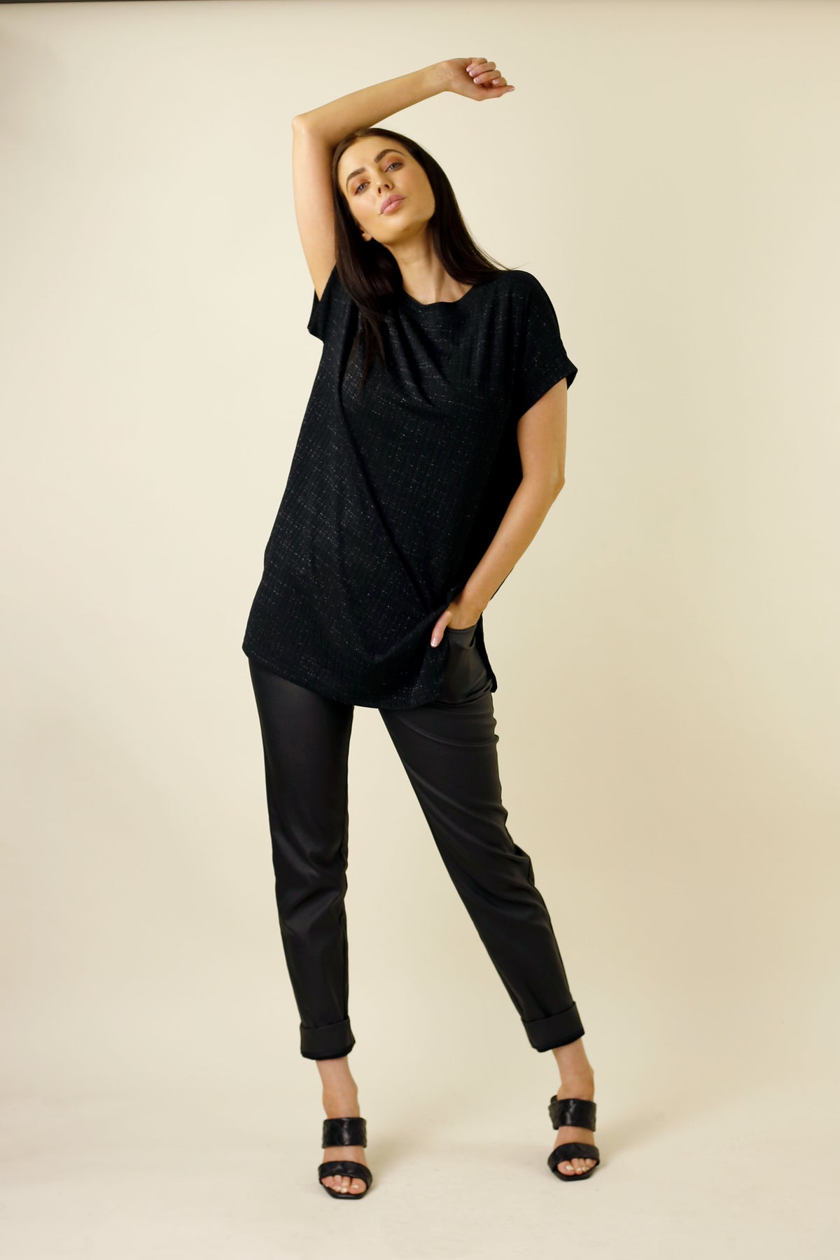 Black Lurex Twinkle Vest styled oversized with cuffed trousers and heeled sandals, an effortless elevated layering piece.