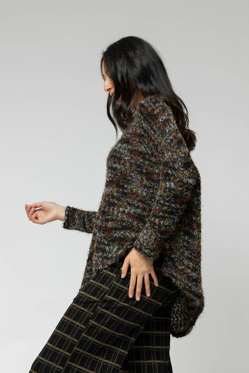 Effortless side view of the Black Speckle Fluffy V Neck Jumper, relaxed silhouette, with close-up knit and plaid crops.