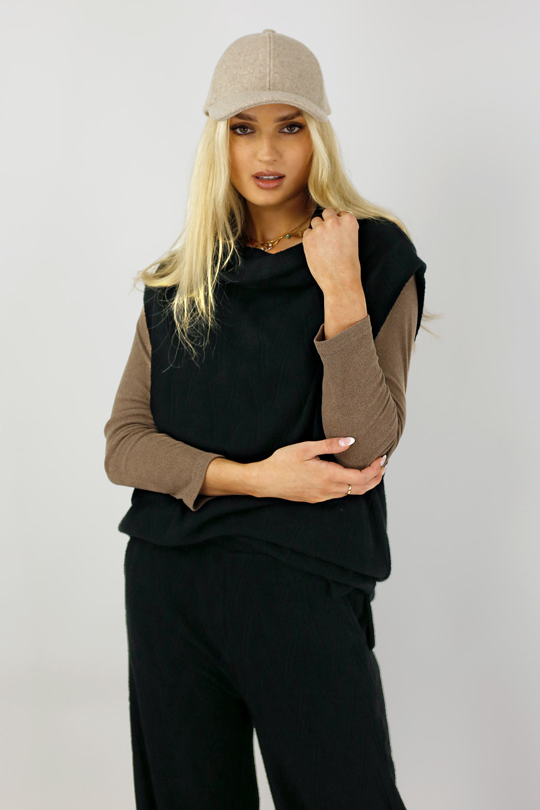 Black Cosy Cowl Vest over a taupe skivvy, chevron knit and relaxed cowl neckline in an effortless sport-luxe layering look.