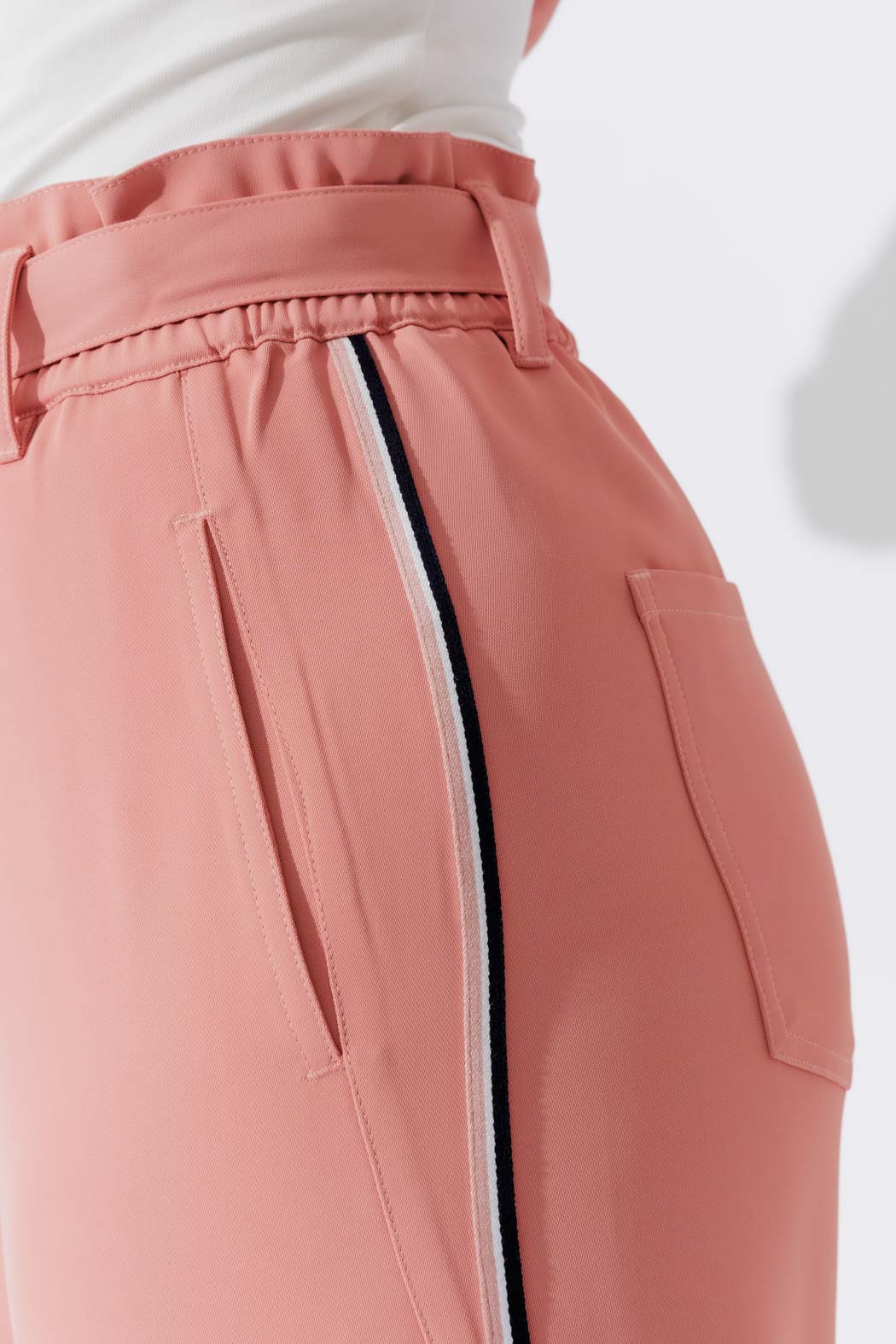 Effortless Blush Sport Paperbag Pant on model, front view highlighting wide elastic waist, D‑ring belt and side pockets.