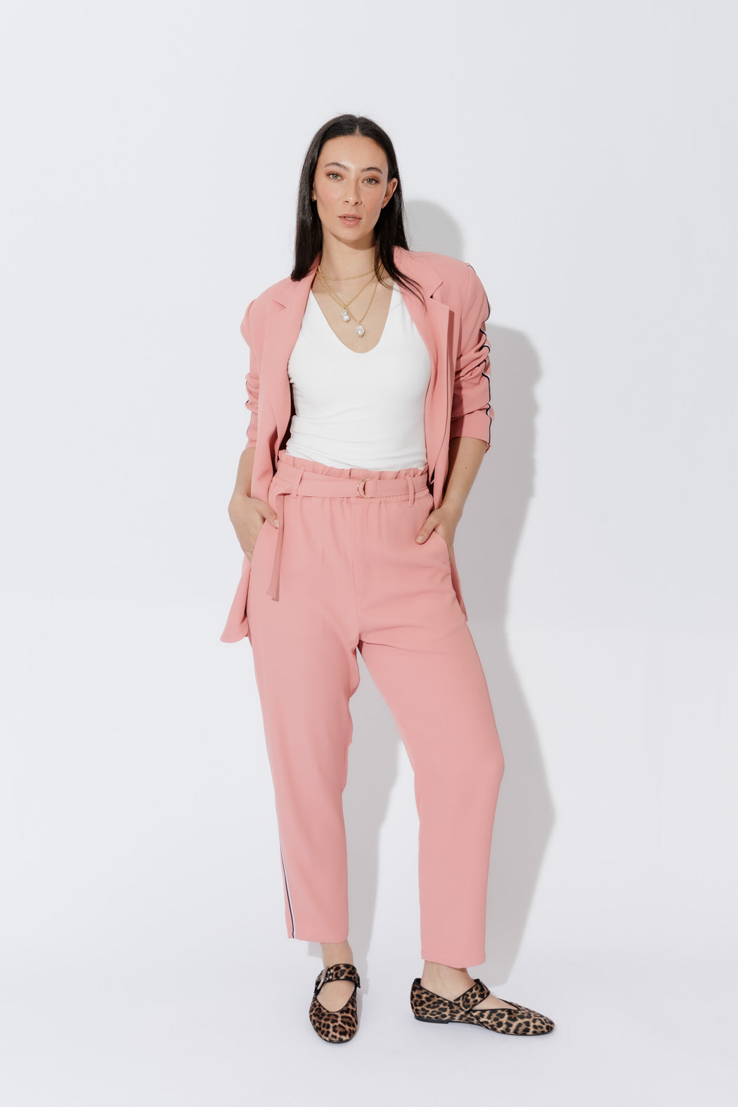 Model wears the Blush Sport Paperbag Pant, effortless front view, showcasing the wide elastic waist, D‑ring belt and sleek side pockets.