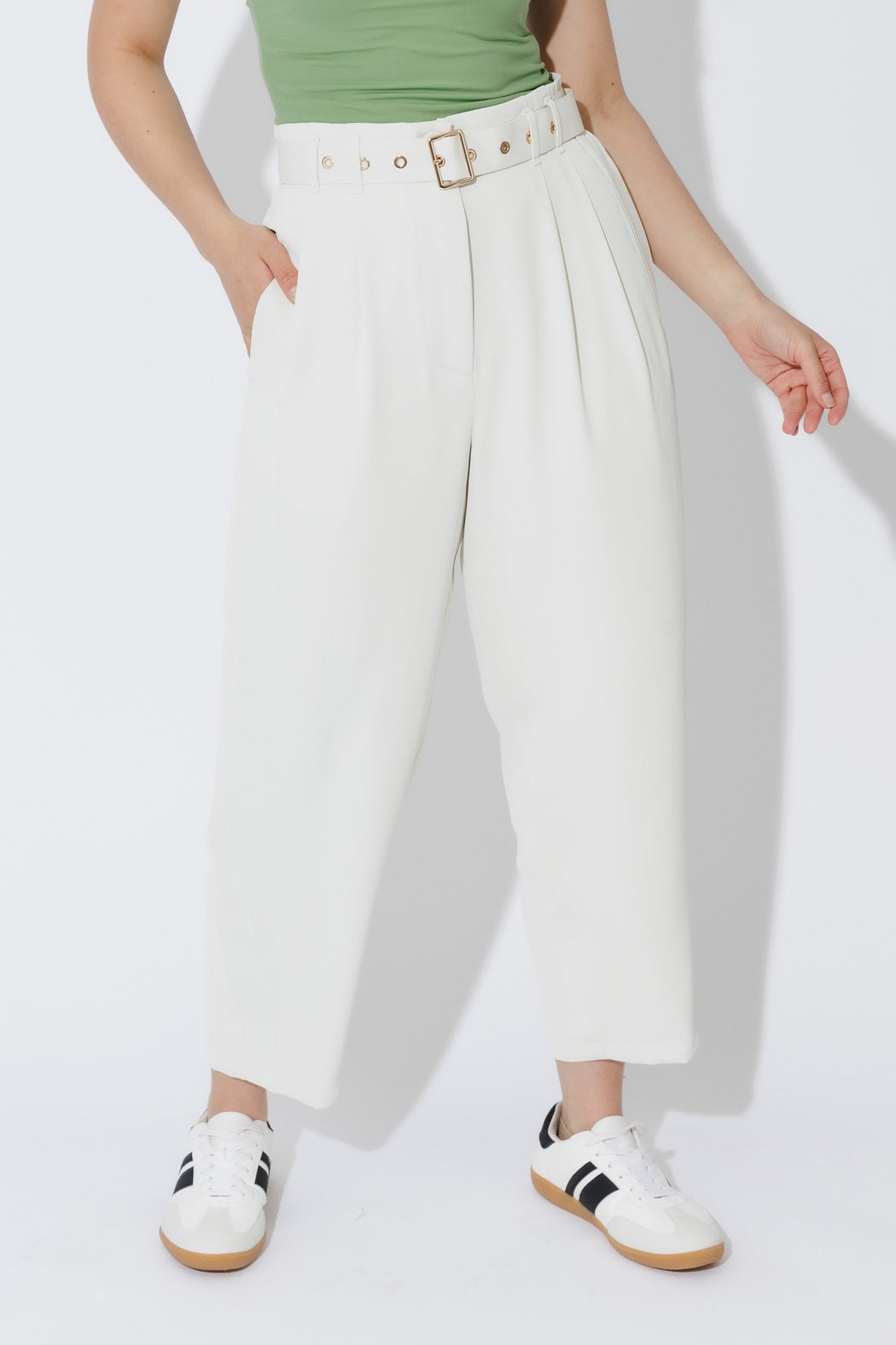 Ivory Euro Barrel Cleo Pant styled with a matching belt and gold buckle, shown full-length with a relaxed sport-luxe edge.