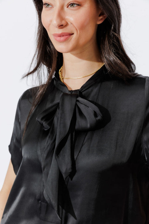 Black Silky Tie Collar Shirt in close-up detail, showcasing the soft bow tie collar and elevated satin drape.