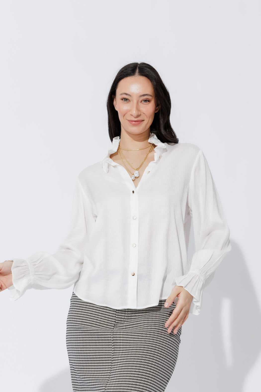 White Frill Shirt front‑on, highlighting its frill collar, button‑up front and elastic cuffs for an effortless, elevated look
