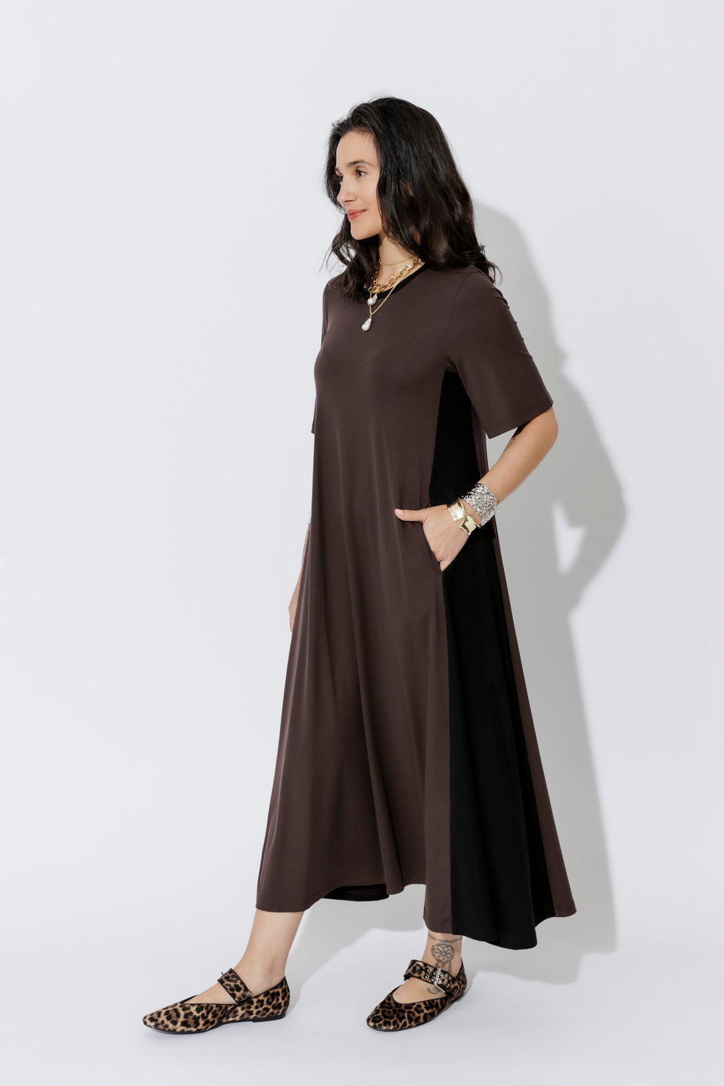 Fluid A-line Chocolate Tencel Bella Dress, styled with layered gold and leopard flats for effortless, elevated ease.