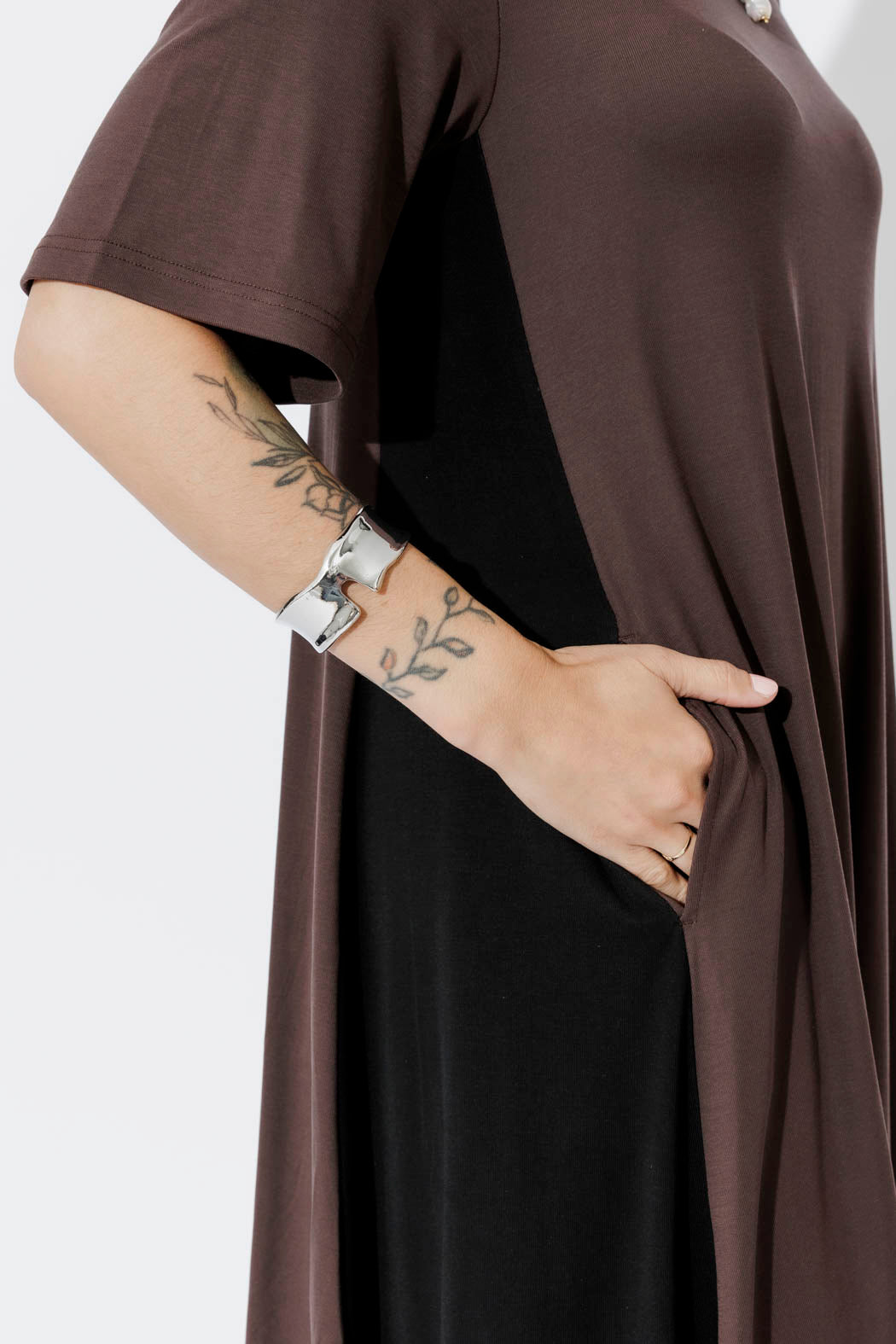 Chocolate Tencel Bella Dress detail — fluid drape, soft sleeve and side pocket in elevated work-wear ease.