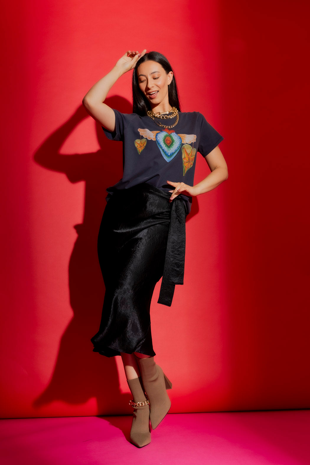 Black Bias Belted Skirt in lustrous satin, styled with a tie belt for an effortless, elevated midi silhouette.