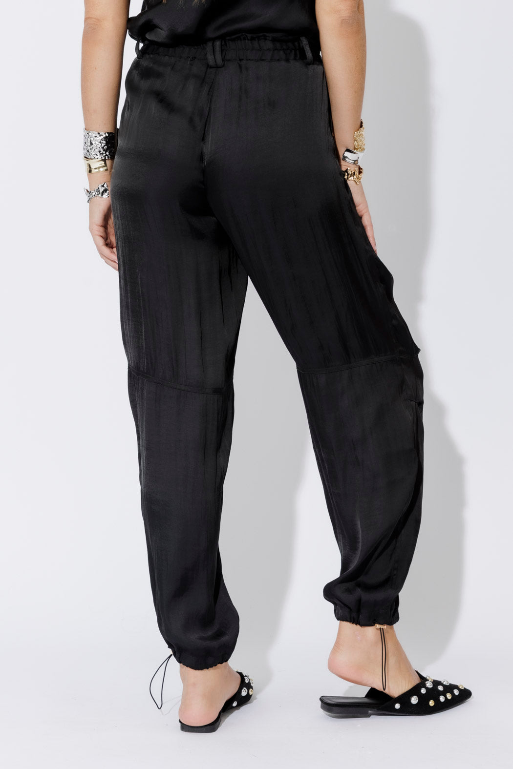 Black Glow Shell Pant in a relaxed ankle-grazing cut, with elasticated waist, side seam and toggle hem detail.