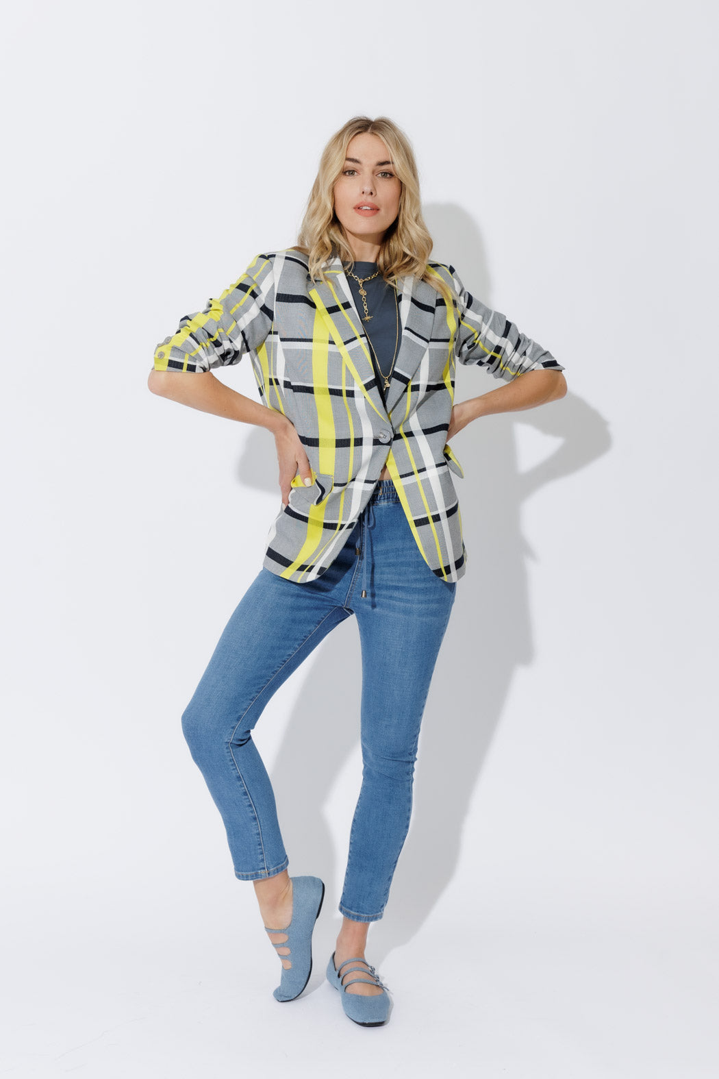 Neon Check Boyfriend Blazer in grey, black and yellow, styled with denim for an effortless elevated look.