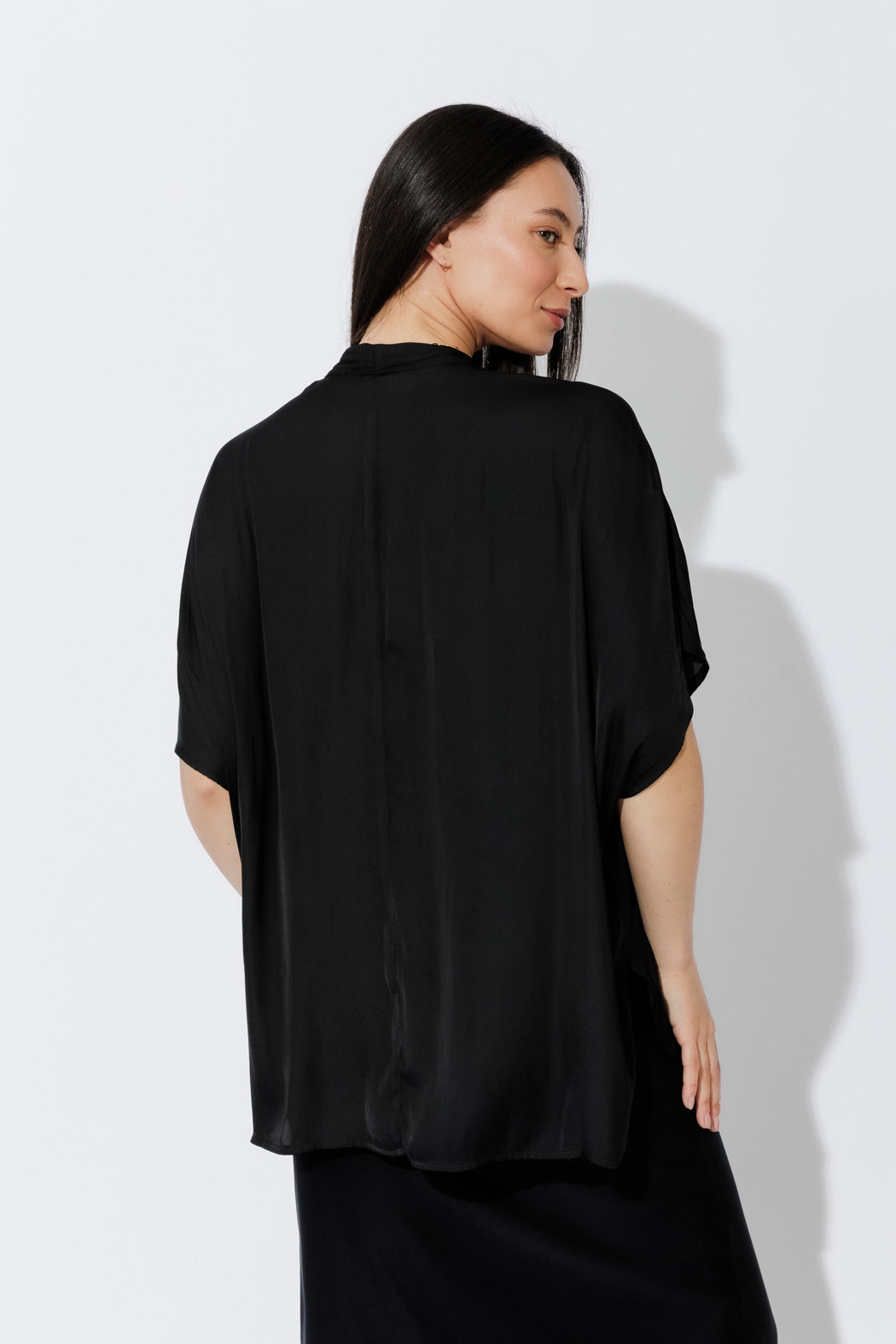 Effortlessly chic Black Tie Bondi top draped on a model, view showcasing oversized silhouette, V‑neck and long ties.