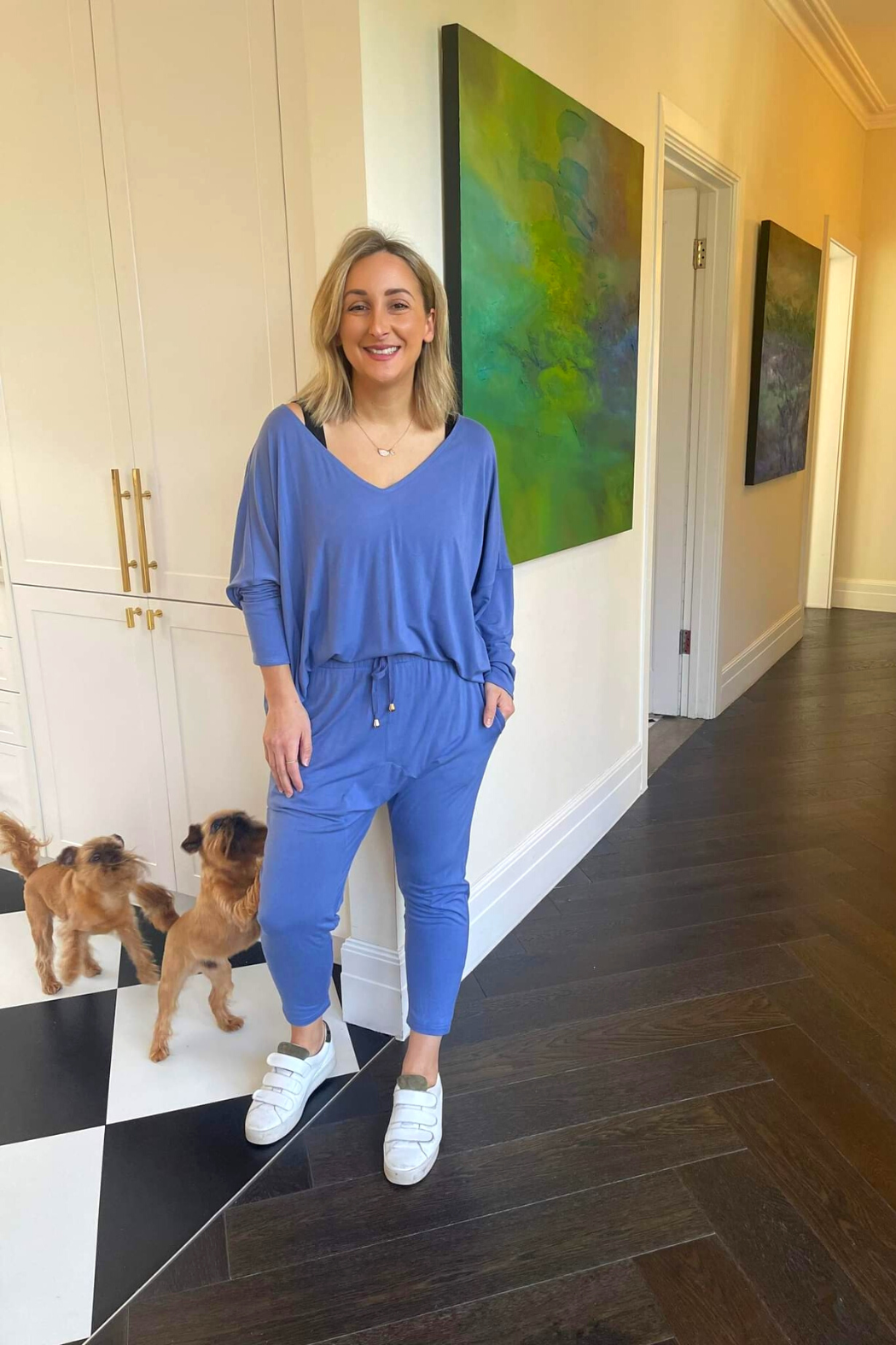 Blue Bamboo Slouch Top in a relaxed V-neck drape, styled with matching joggers and white sneakers for effortless ease.