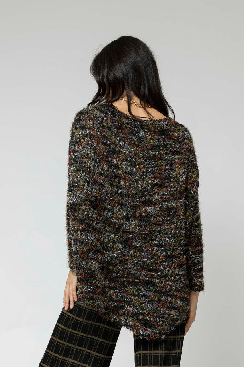 Back view of the Black Speckle Fluffy V Neck Jumper, showcasing its elevated speckled knit and relaxed hi-lo hem.
